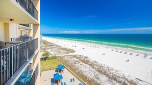 A high-rise hotel with balconies overlooking a beach. - Phoenix V by Brett/Robinson Vacations (Orange Beach)