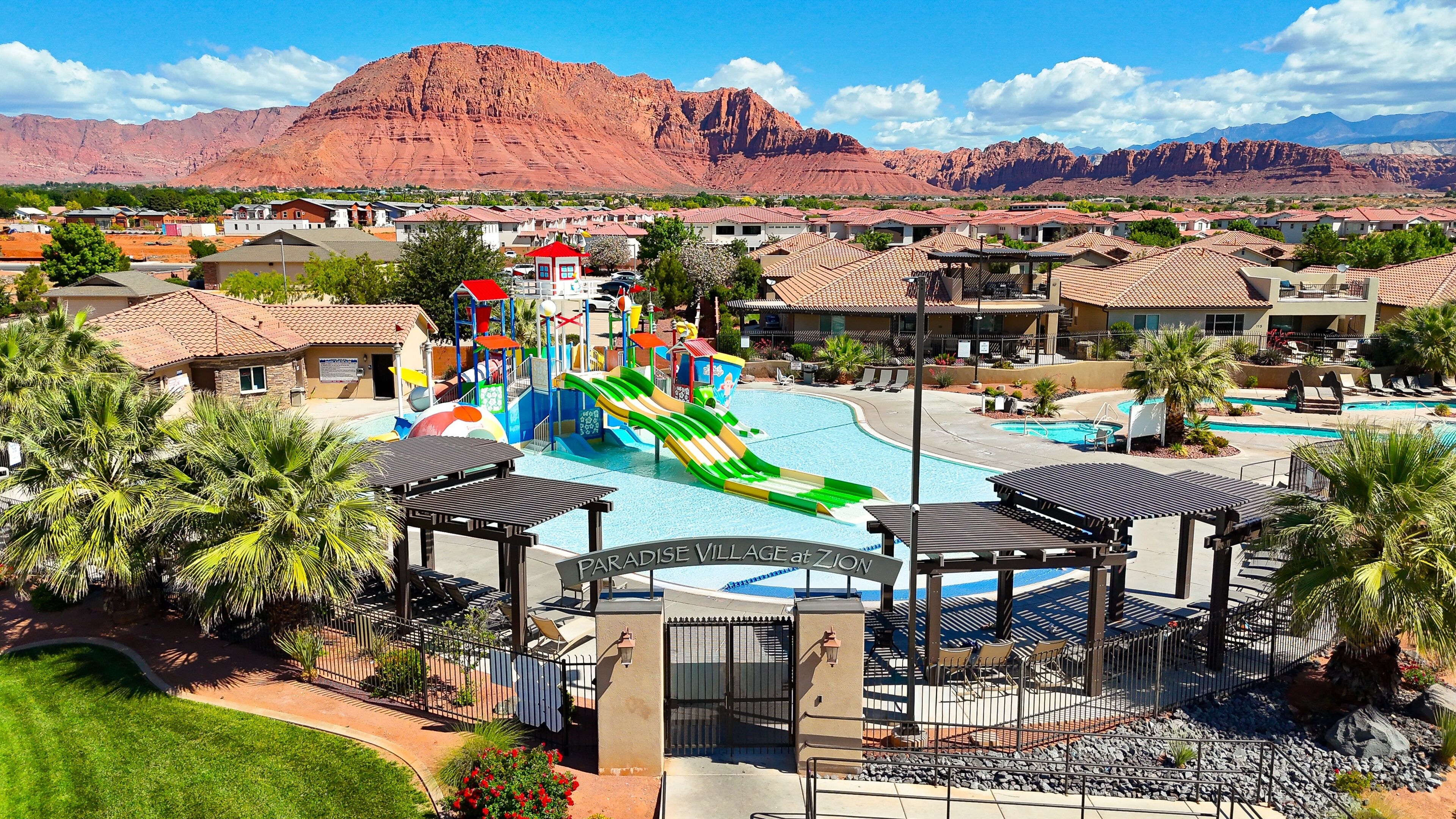 A resort with a water park, pool area, and mountain views.