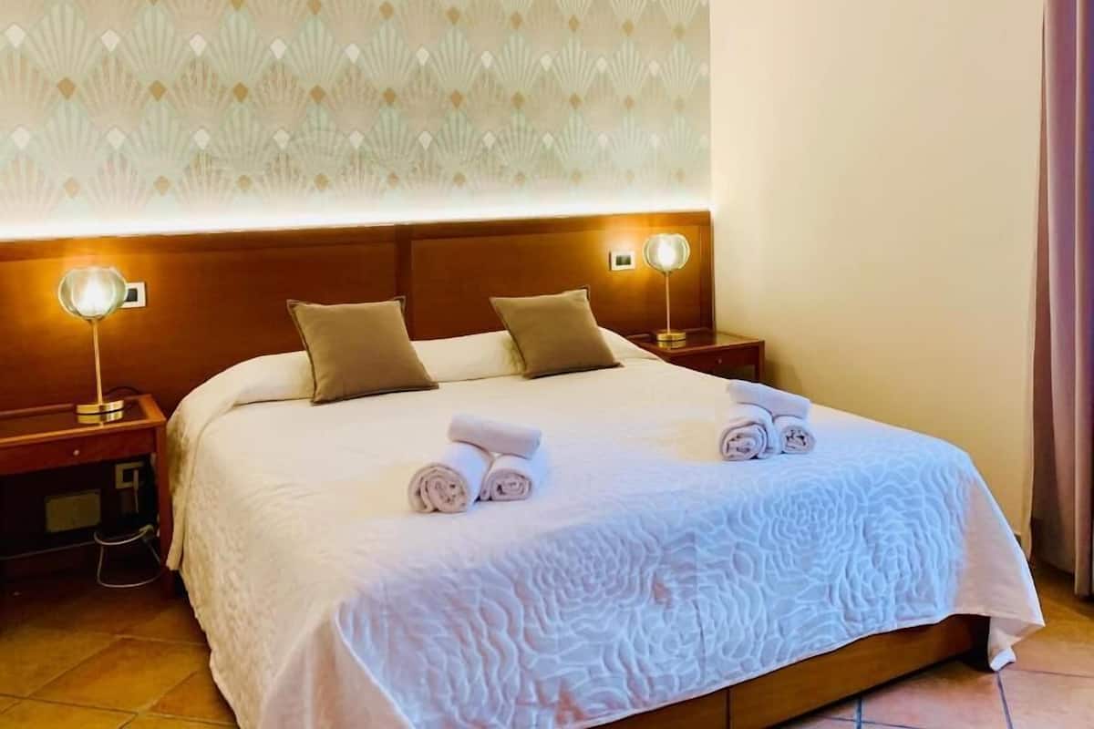 Appartement Deluxe, vue ville | Coffres-forts dans les chambres, chambres insonorisées, Wi-Fi gratuit