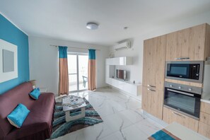 Departamento, vista a la ciudad | Área de sala de estar