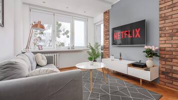 Classic Apartment, Courtyard View | Living area | 40-inch plasma TV with digital channels