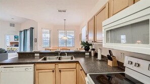 Fridge, microwave, oven, stovetop - 509 Relax & Play at This 6BR Pool Home (Haines City)