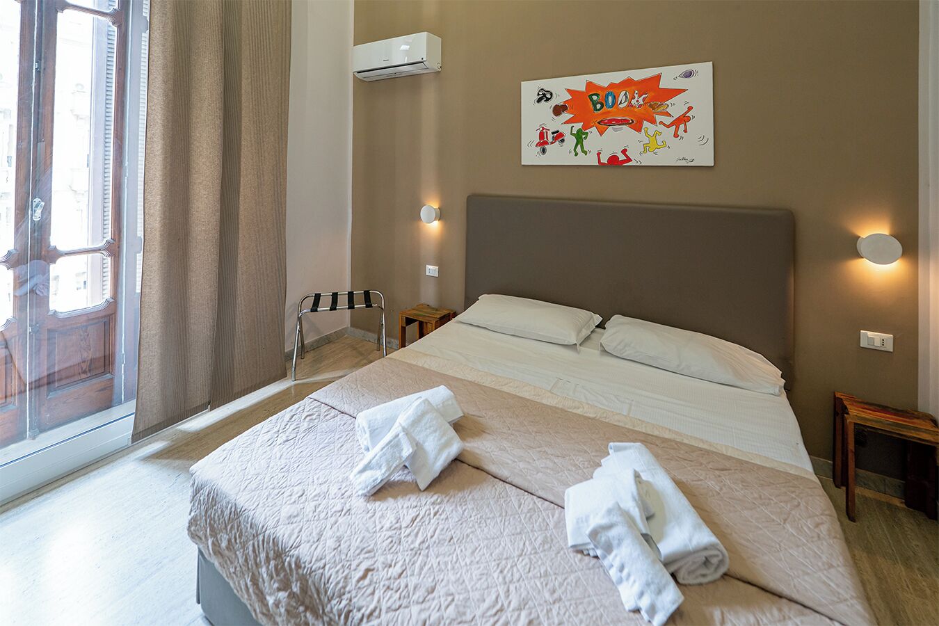 Deluxe Room, Balcony, City View | Desk, laptop workspace