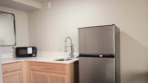 Deluxe Double Room | Private kitchen | Full-sized fridge, microwave