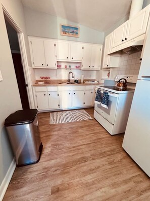 Fridge, microwave, oven, stovetop - Penguins on the Beach | 1BR Surf Shack Steps to Beach & Downtown w/pool | Unit D (Cocoa Beach)