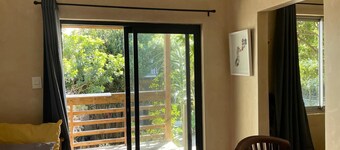 Garden Cottage with Hot Tub in beautiful eco village - 5 mins walk to the beach