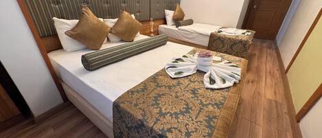 Standard Triple Room, City View | In-room safe, soundproofing, iron/ironing board, free WiFi