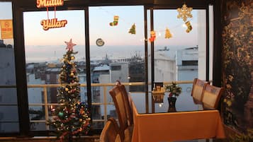 Standard Quadruple Room, City View | Dining