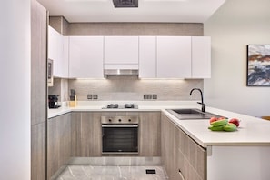 Private kitchen - Newly Furnished 1BR Serene Sanctuary (Dubai)