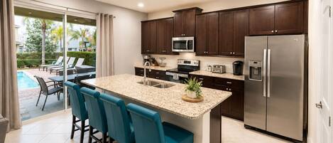 Coffee/tea maker, fridge, microwave, oven
