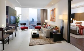 A modern hotel room with a city view, a dining area, and a living space. - Sedra Al Alami Jeddah Hotel Apartments (Jeddah)