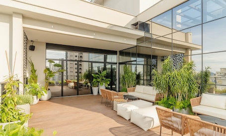Terrace/patio. Your Exclusive Stay Just Steps From the sea in Meia Praia - FFS II