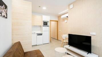 Apartment, 1 Bedroom | Living area | 30-inch Smart TV with digital channels