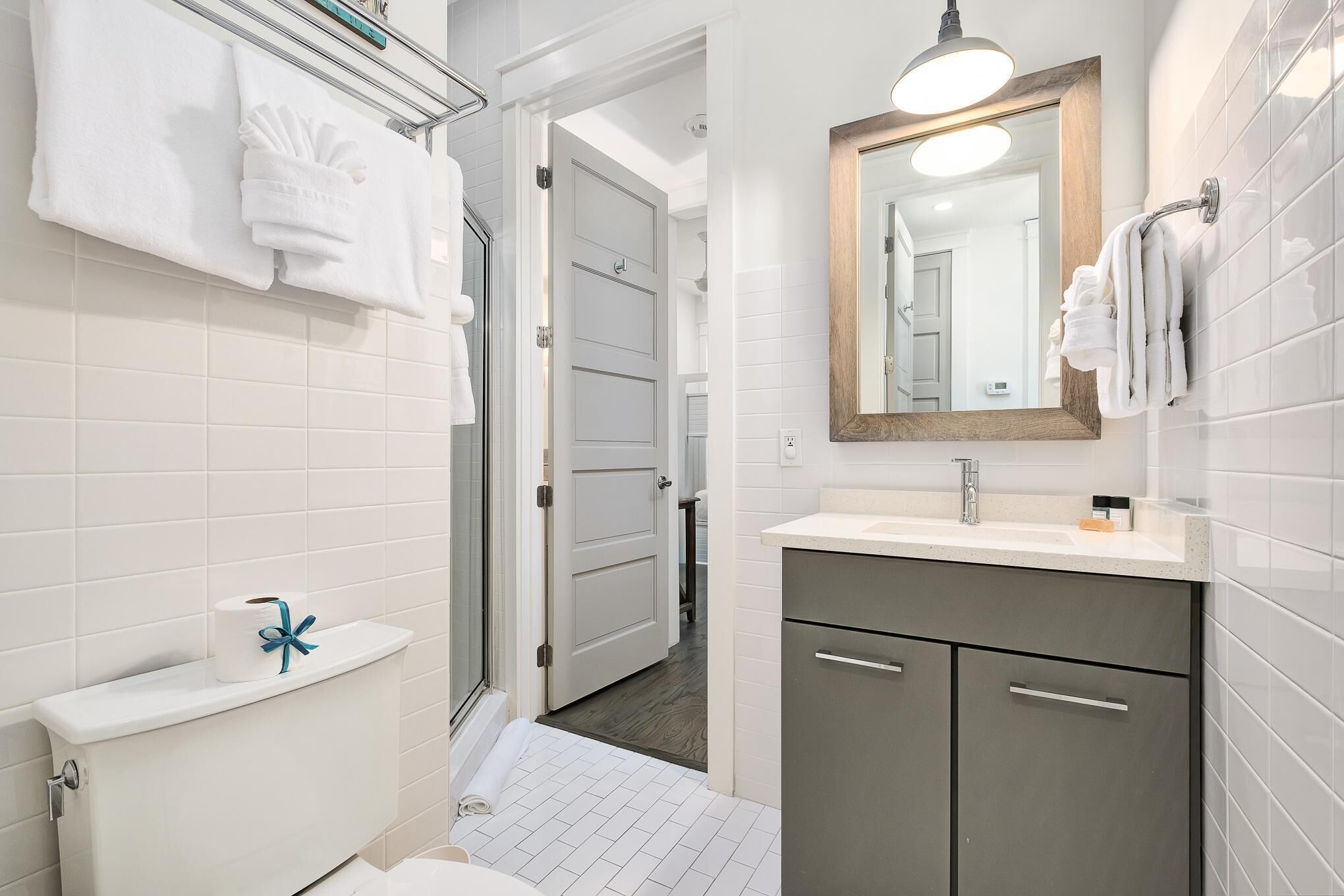 Step into your modern bathroom sanctuary with a soaking tub, walk-in shower, and plush robes waiting for your arrival.