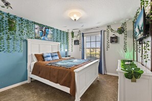 A bedroom with a bed, a dresser, and a TV. - Private Pool~ Massage Chair~ Games ~ Themed Villa (Kissimmee)
