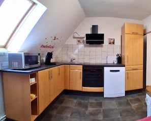 Appartement | Privékeuken | Een kinderstoel