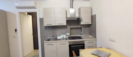 Comfort Apartment, City View | Private kitchen | Shared fridge, microwave