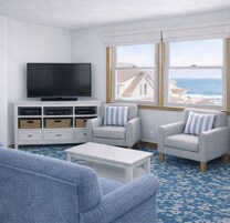 Deluxe Studio Suite, Partial Ocean View | Living area | 32-inch Smart TV with digital channels, books