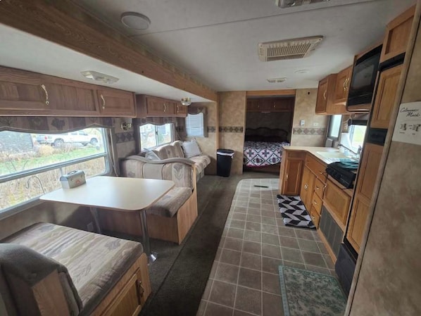 Room - Spacious RV Rental Sleeps 8 — Full Kitchen, A/C, Fire Ring & Picnic Area (Cornell)