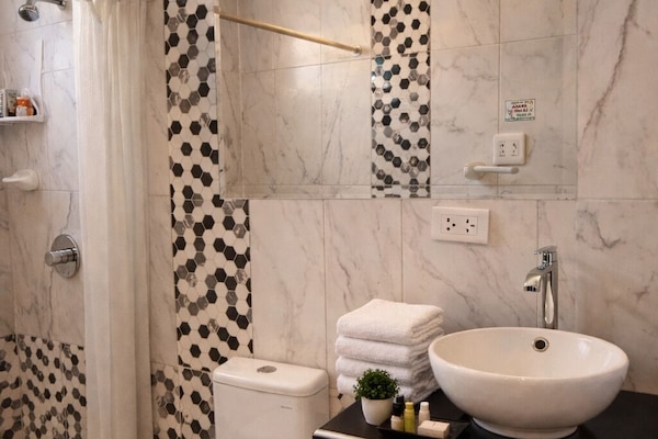 Shower, towels, soap, toilet paper