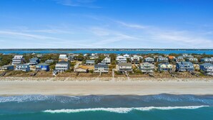 A coastal residential area with beachfront properties, a sandy beach, and the ocean. - Spring Discount! 300ft to Beach+Heated Pool/Multiple Decks with Ocean Views (Emerald Isle)