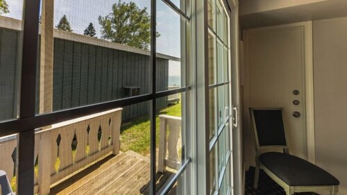 Great room with two Full beds. Lake view from deck