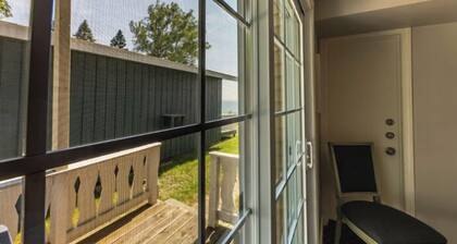 Great room with two Full beds. Lake view from deck