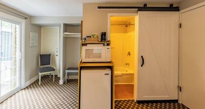 Great room with two Full beds. Lake view from deck