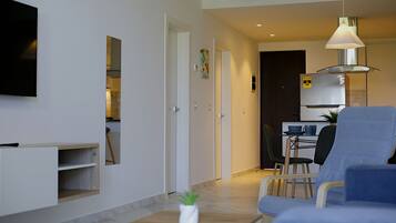 Apartamento exclusivo | Área de estar | TV LED 55 polegadas com canais digitais, Netflix, serviços de streaming