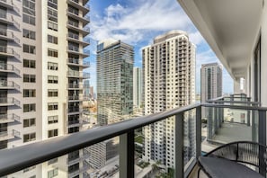 A high-rise residential building with multiple balconies, large windows, and a view of other high-rise buildings. - Crosby Miami WTC 1BR/1BA Downtown All New #3212 (Miami)