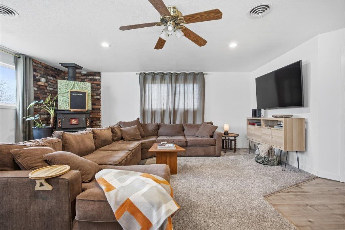 Cozy sofa in the living room area with 65" television