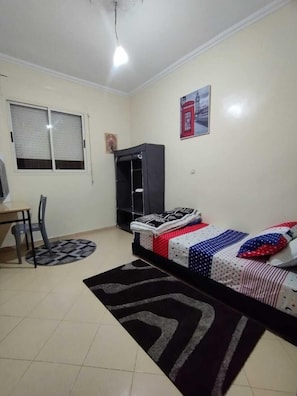 A small, clean room with a bed, a desk, a chair, and a wardrobe. - Cozy Room Ain Chock Near Casa Nearshore (Casablanca)