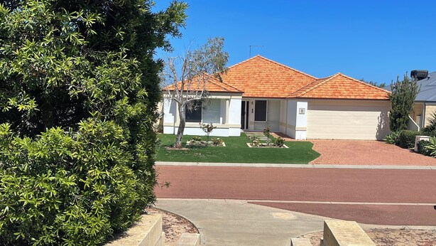 A residential house with a red-tiled roof, a front lawn, and a driveway leading to the entrance. - Why have a room when for the same price you can have a whole gorgeous house! (Lakelands)