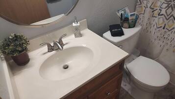 Hair dryer, towels, soap, toilet paper