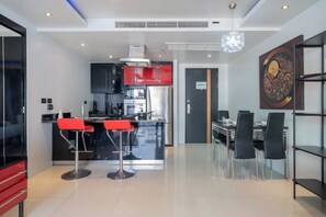 Deluxe Apartment, 1 Bedroom, Balcony, City View (Absolutely Amazing Bangla 1BR Suite) | Living area | 55-inch Smart TV with digital channels - Absolutely Amazing Bangla 1Br Suite (Patong)