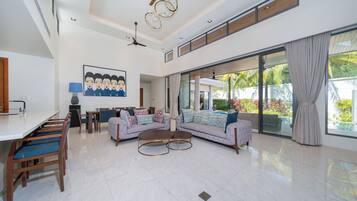 Executive Villa, 4 Bedrooms (BreezePrivate Pool Luxury in BangTao) | Living area | 65-inch Smart TV with digital channels