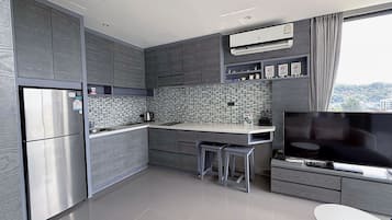 Deluxe Apartment, 1 Bedroom (CityGate Kamala 1BR Altitude Suite) | Private kitchen | Full-sized fridge, microwave, stovetop, cookware/dishes/utensils