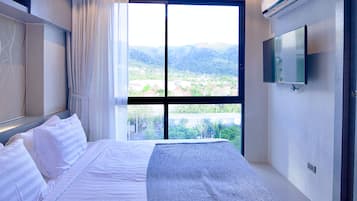 Apartment, 1 Bedroom (Serenity in CityGate Kamala Resort) | In-room safe, iron/ironing board, free WiFi