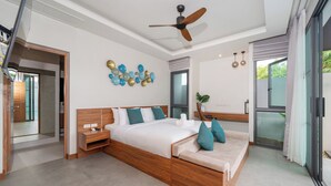 A modern bedroom with a wooden bed, a desk, and a ceiling fan. - Nicky Elegant 3Br Pool Villa Bangtao (Choeng Thale)