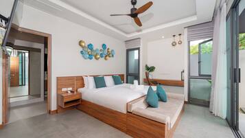 A modern bedroom with a wooden bed, a desk, and a ceiling fan.