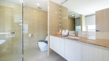 Apartment, 2 Bedrooms (Ozone Condo in Splendid Laguna Area) | Bathroom | Shower, rainfall showerhead, hair dryer, slippers