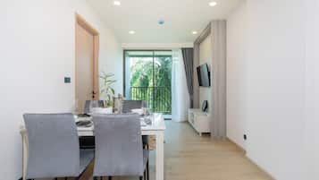 Apartment, 1 Bedroom (Ozone Condo Prestigious Laguna Area) | Living area | 55-inch LED TV with digital channels