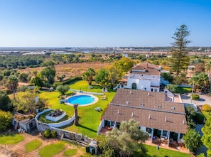 A large house with a swimming pool, surrounded by greenery and a clear view of the sea. - A peaceful Fuseta escape with terrace, garden, and private parking. (Fuseta)