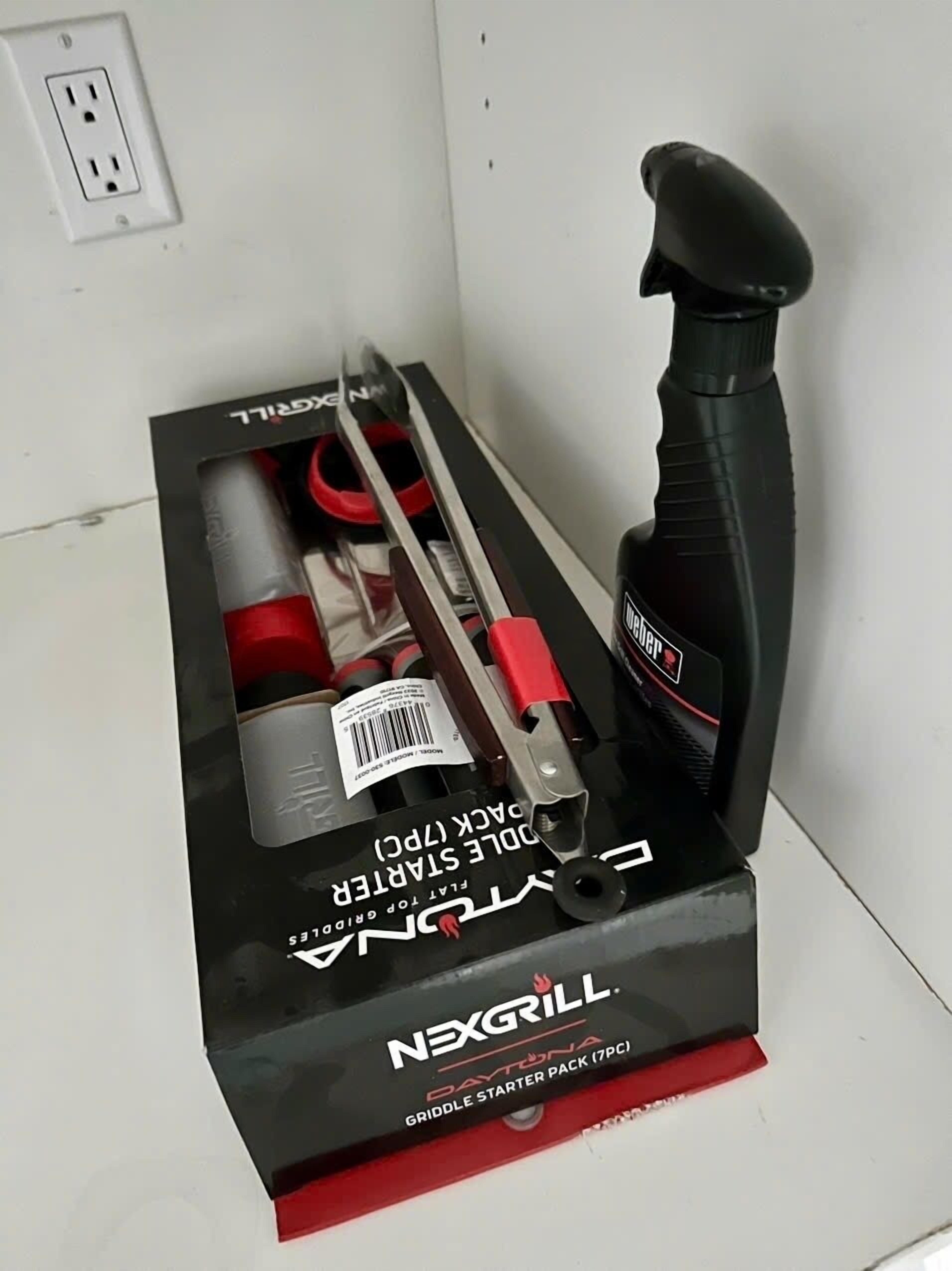 A box labeled 'NEXGRILL Daytona Griddle Starter Pack (7PC)' containing grilling tools.