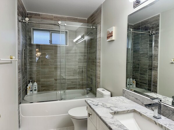 Shower, hair dryer, towels, soap