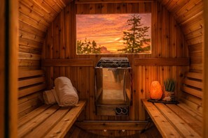 A sauna with a Harvia brand heater, a wooden bench, a towel, and a salt lamp. - Red Rock Views • Pool, Spa, Sauna, Cinema & Fitness • Luxe 5BR Sedona Retreat (Sedona)