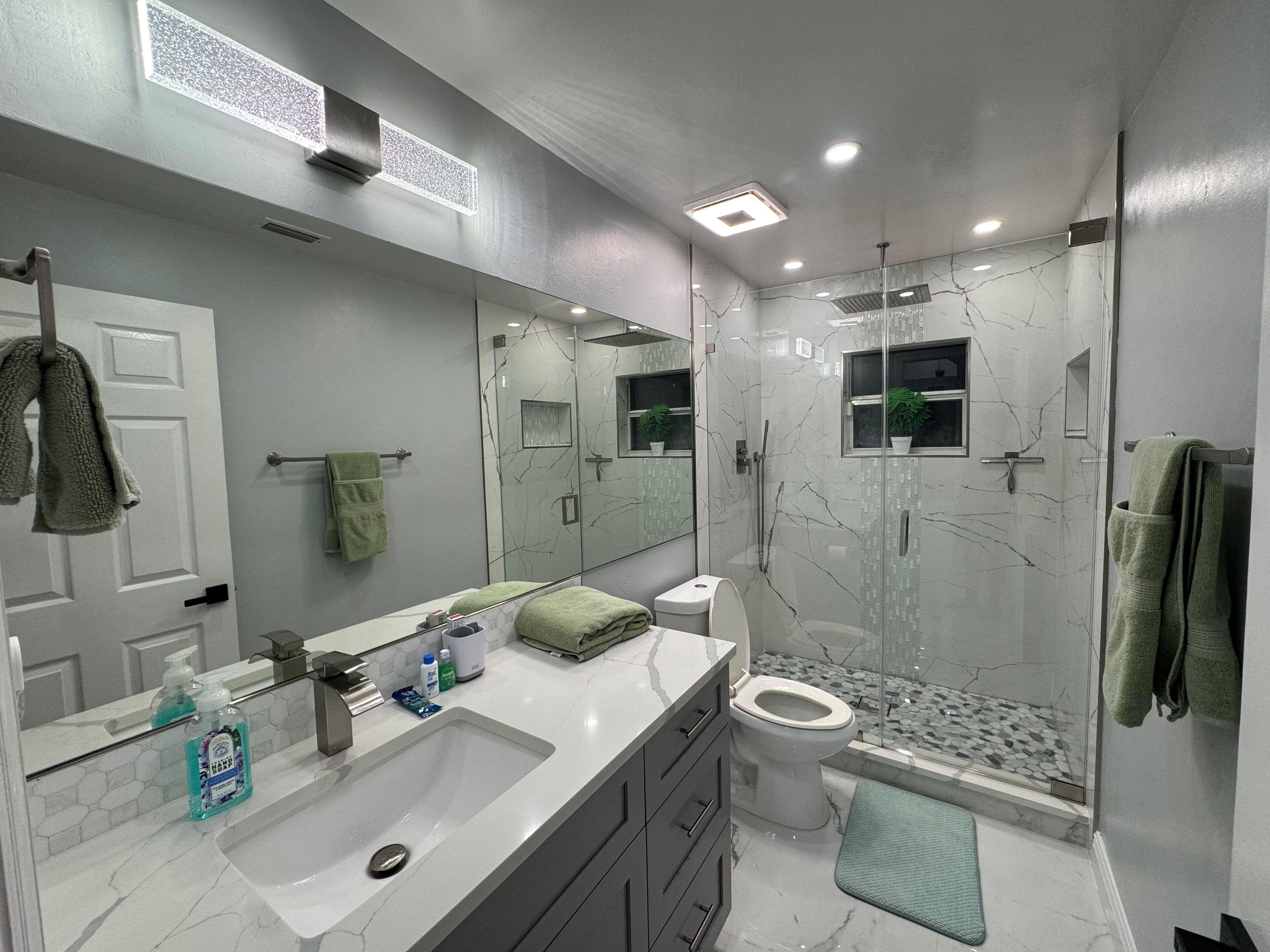 Shower, towels, soap, toilet paper