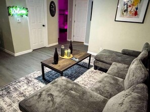 Living area - Modern Neon Retreat Game Room Fire Pit (Ormond Beach)