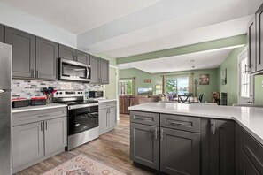 Fridge, microwave, oven, stovetop - Pet-Friendly Lakefront Home | Hot Tub Retreat (Swanton)