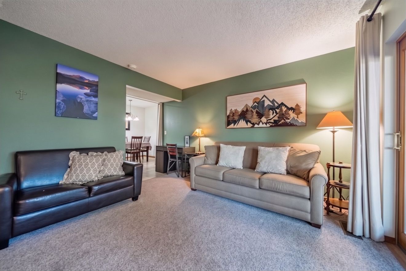 Living area has two sofas and a workspace if you need to catch up on some paperwork